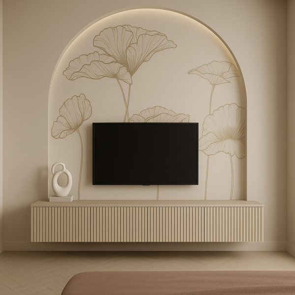 Floating fluted beige TV unit with matte wood finish set inside an arched wall niche featuring soft floral mural and cove lighting.