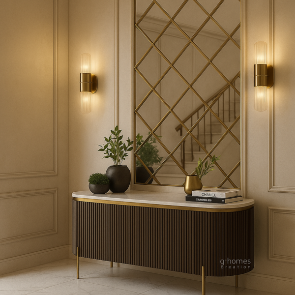 Modern beige entryway design featuring brass sconces and marble top table