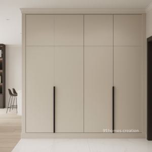 Beige matte built in wardrobe with long black handles.