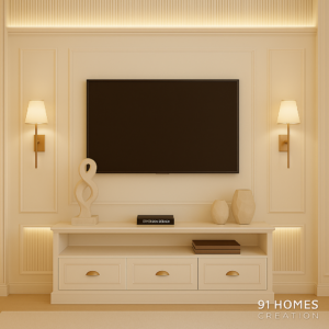 cream-toned tv cabinet with fluted wall panels and warm sconces
