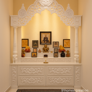Small space marble mandir design with carved white drawers and arch