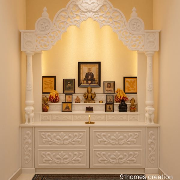 Small space marble mandir design with carved white drawers and arch