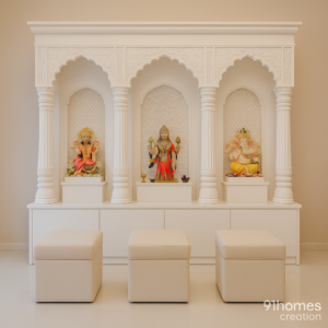 Traditional white marble temple with carved arches and deity idols