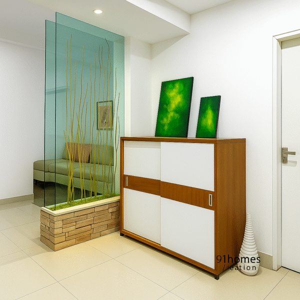 Contemporary interior with frosted glass divider, white and teak-finish cabinet, and green wall art