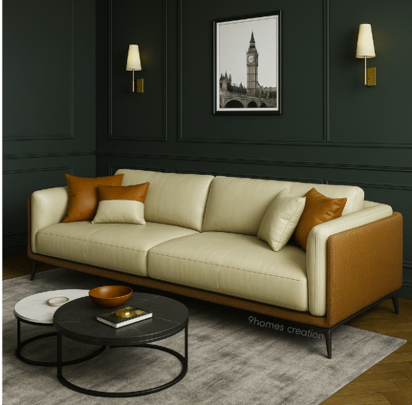 Contemporary low-profile cream couch with rust and beige cushions on wooden flooring