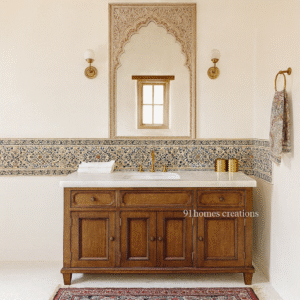 Wooden bathroom vanity with white marble countertop, brass faucet, and Persian mosaic backsplash